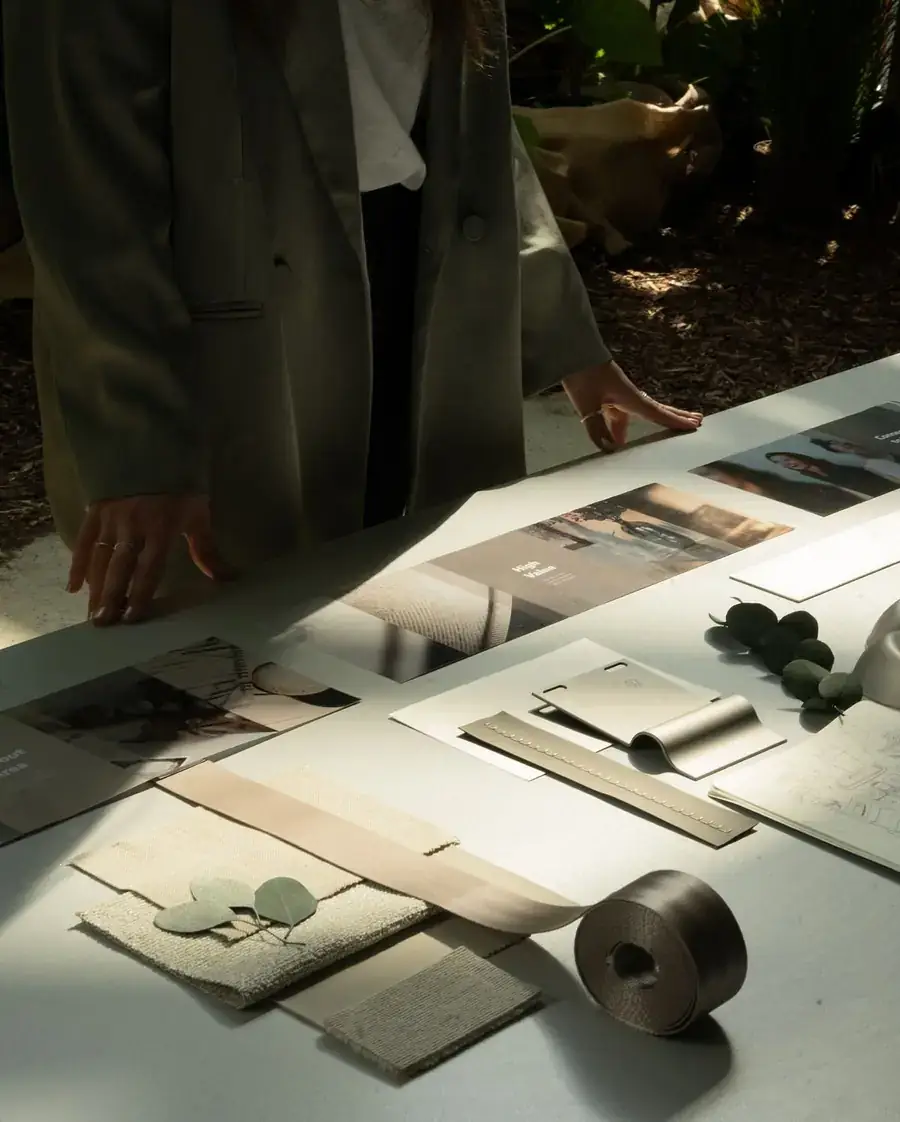 Brand moodboard with print layouts and material samples