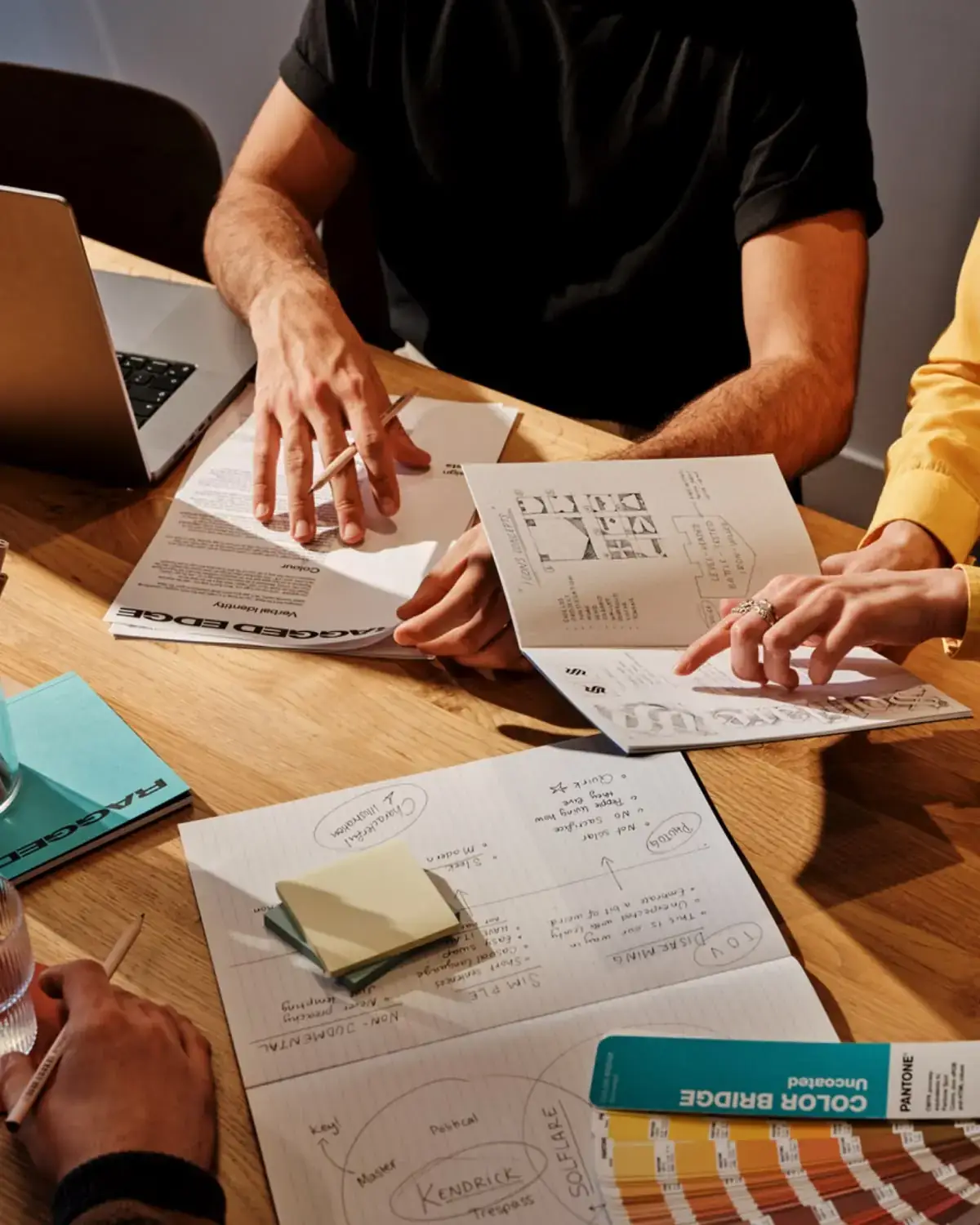 Brand team reviewing identity sketches and colour swatches