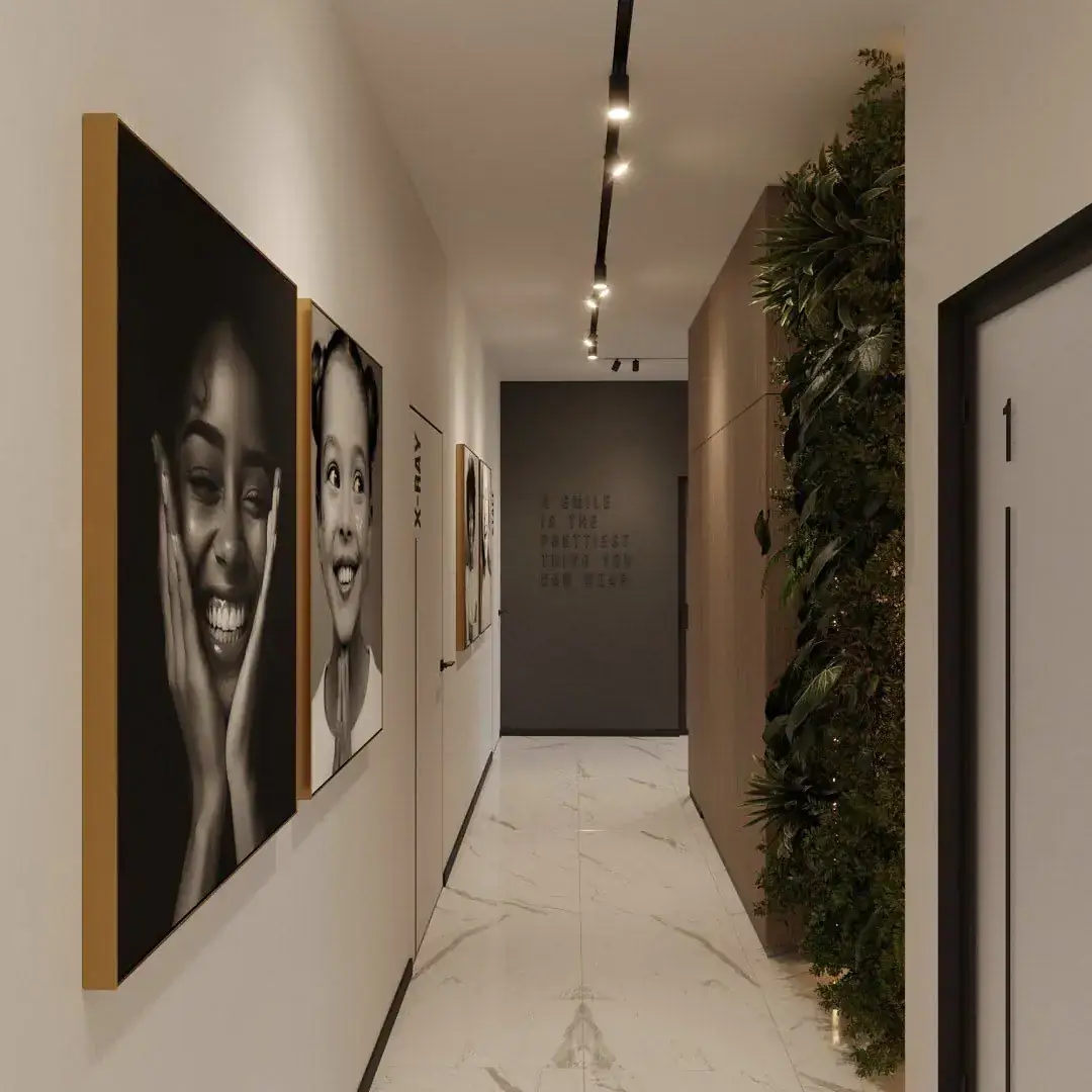 Dental clinic corridor with smiling portrait photographs