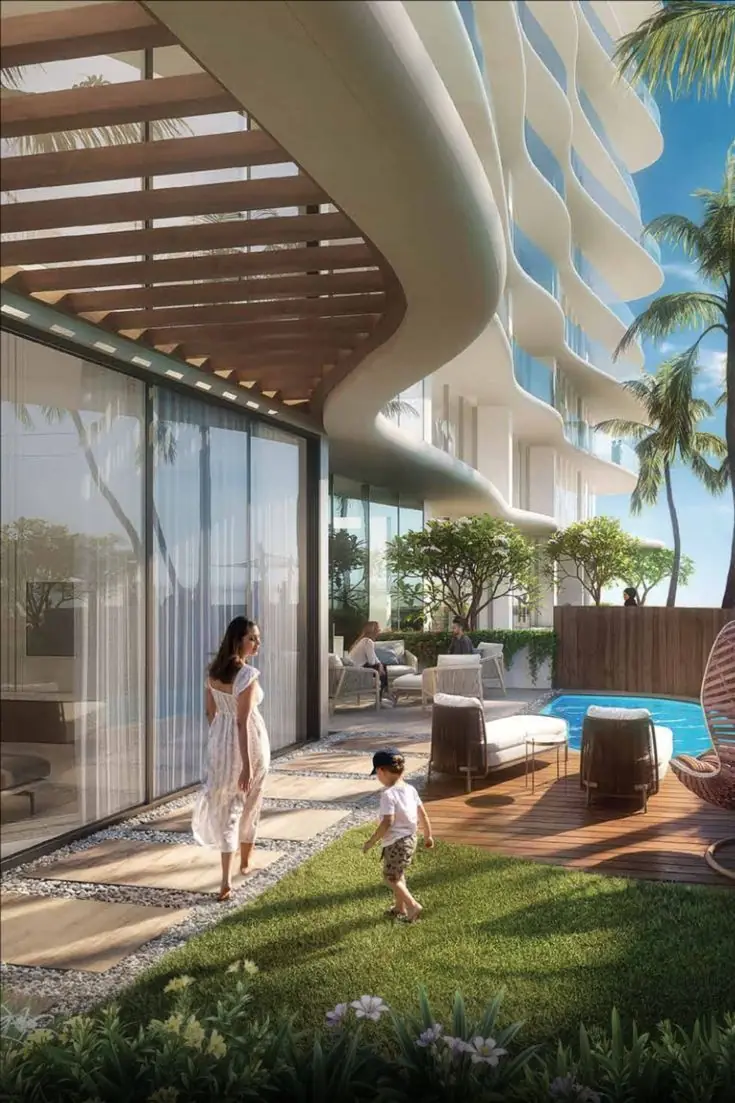 Mother and child in the garden of a luxury residence with a private pool