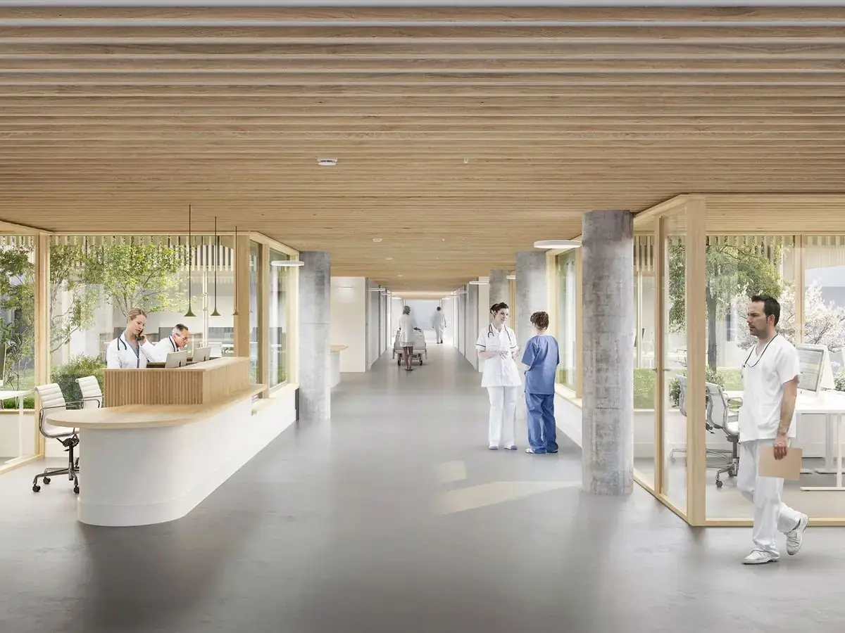 Bright hospital corridor with doctors and nurses at work