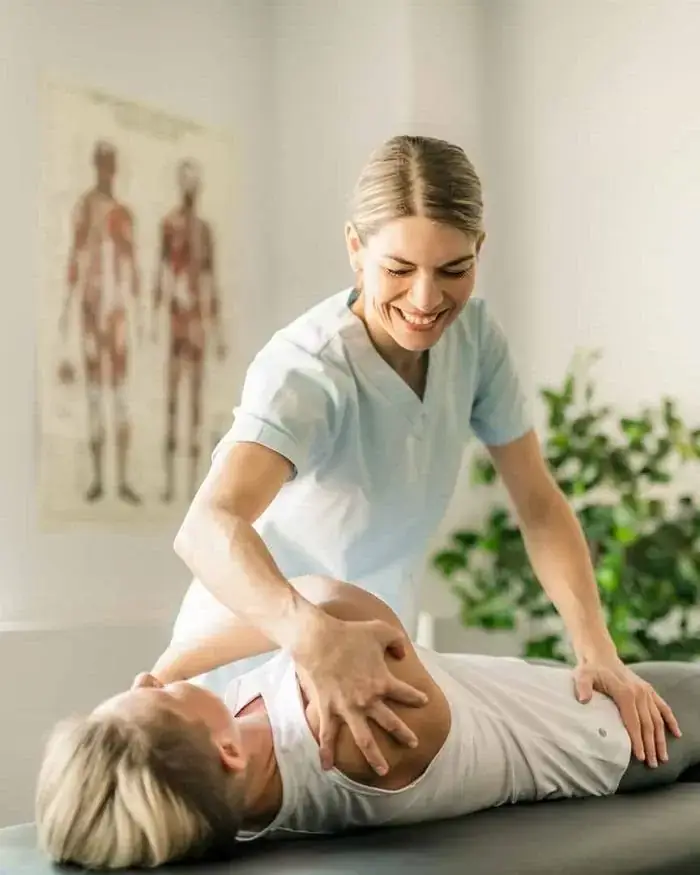 Physiotherapist treating a patient's shoulder