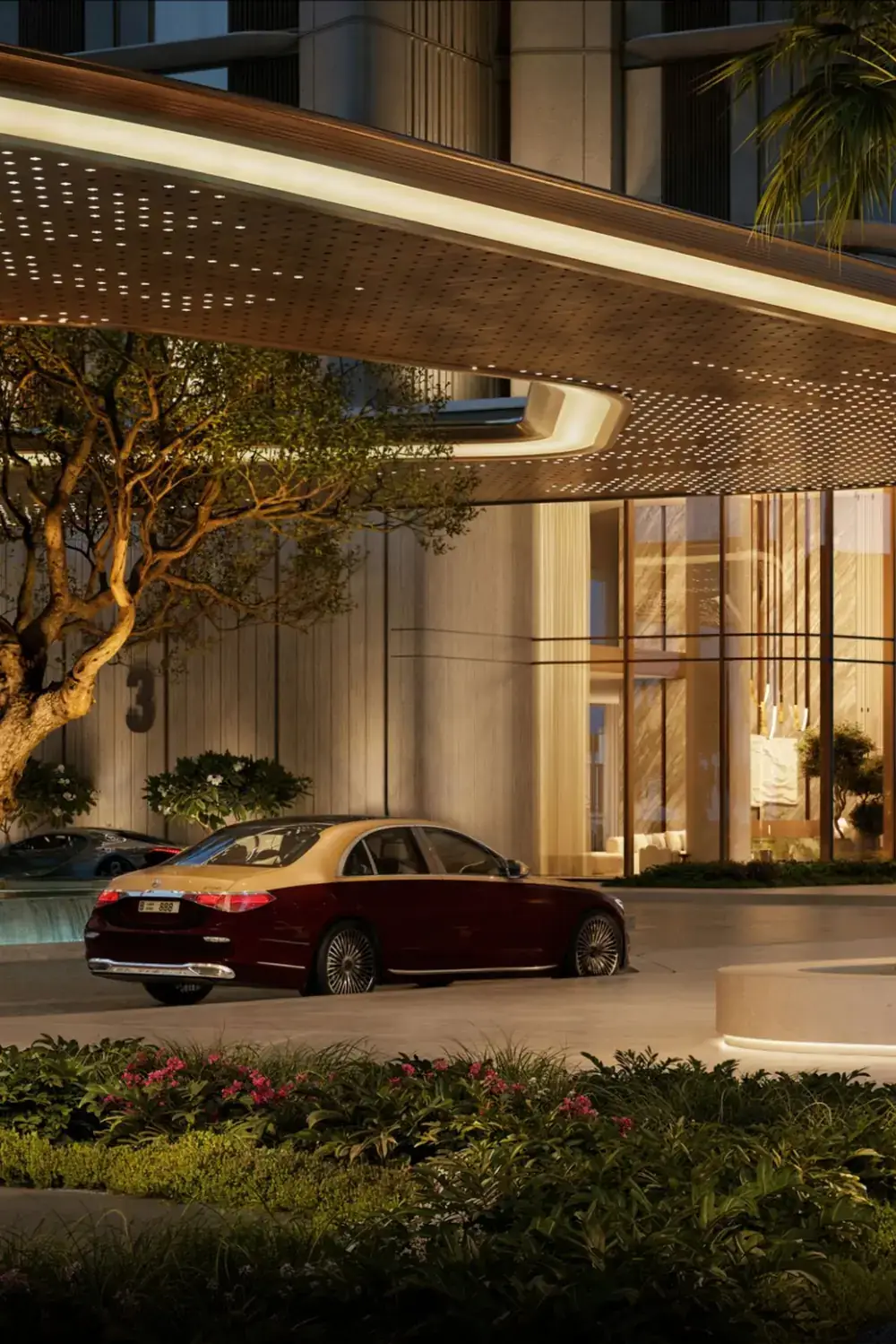Porte-cochere of a luxury residential tower at dusk