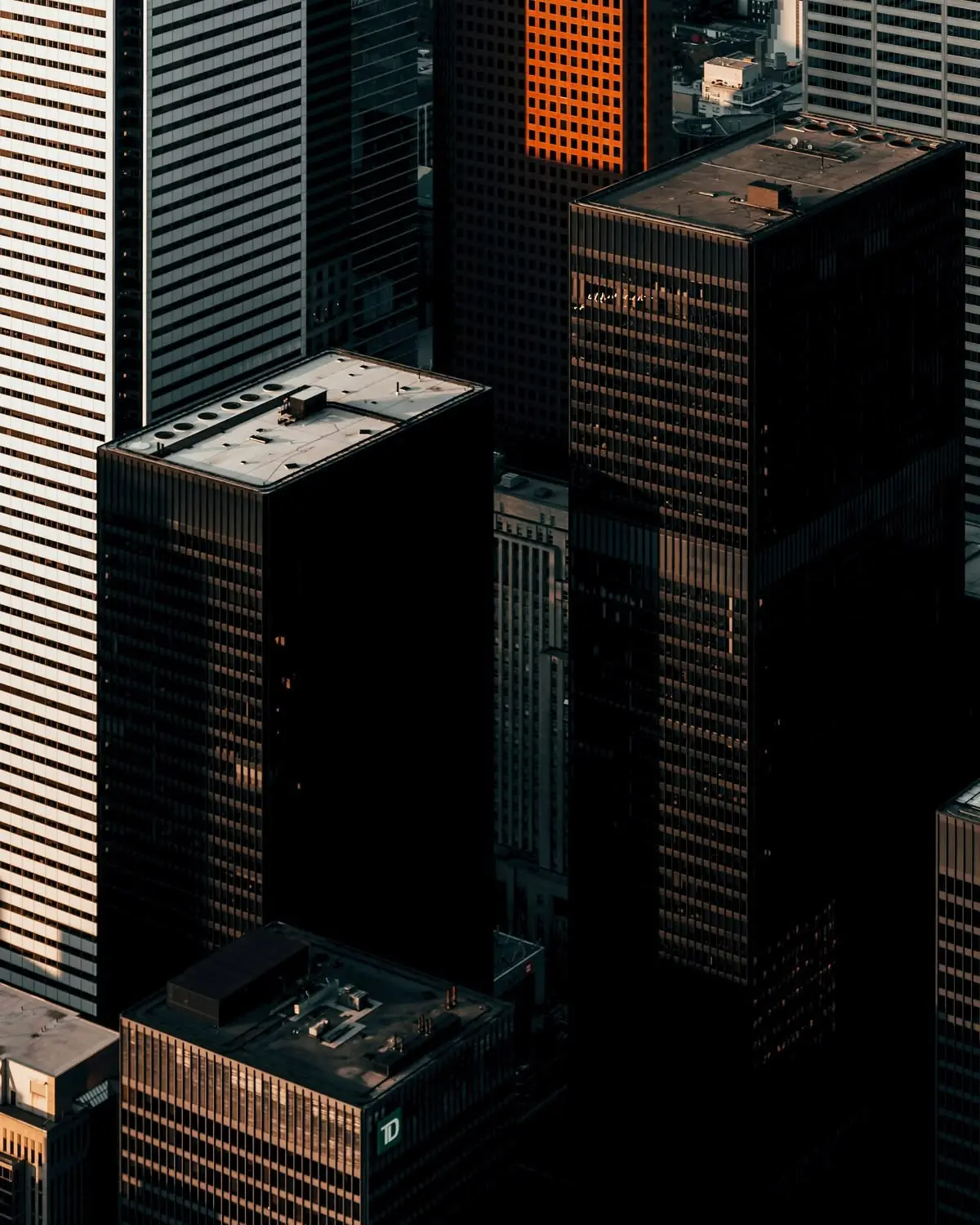 Aerial view of corporate office towers at dusk